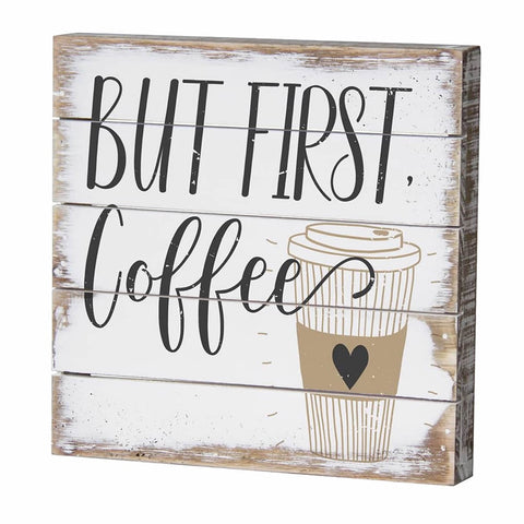 Wooden sign with 'But First, Coffee' text and a coffee cup illustration on a white background